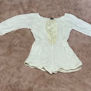 Stylish off white romper.